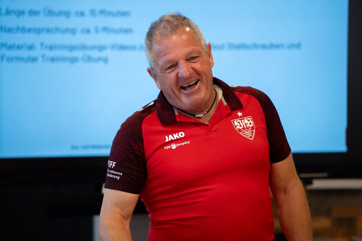 Coach leading an inclusive football workshop.