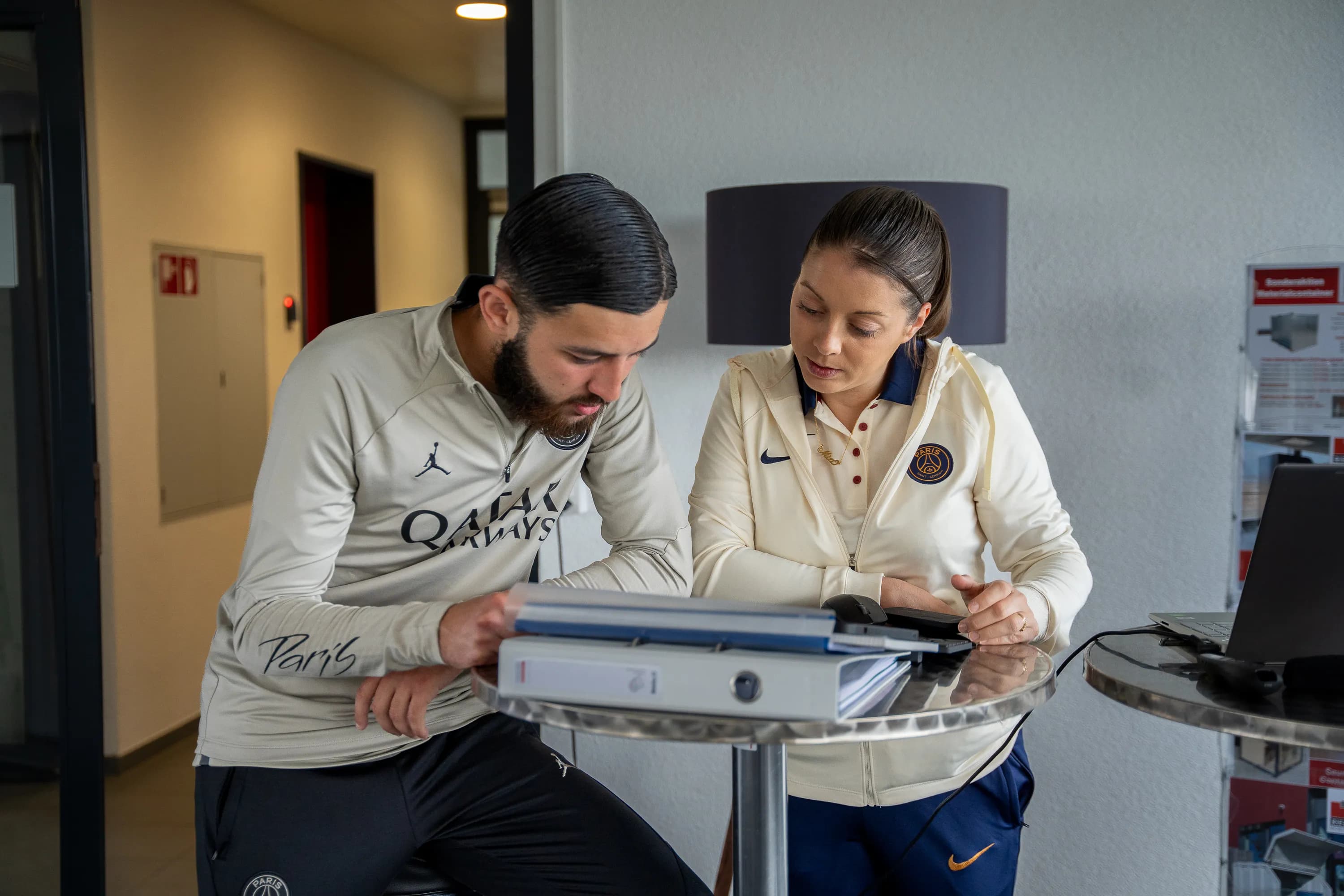 FIM partners celebrating their collaboration on the pitch