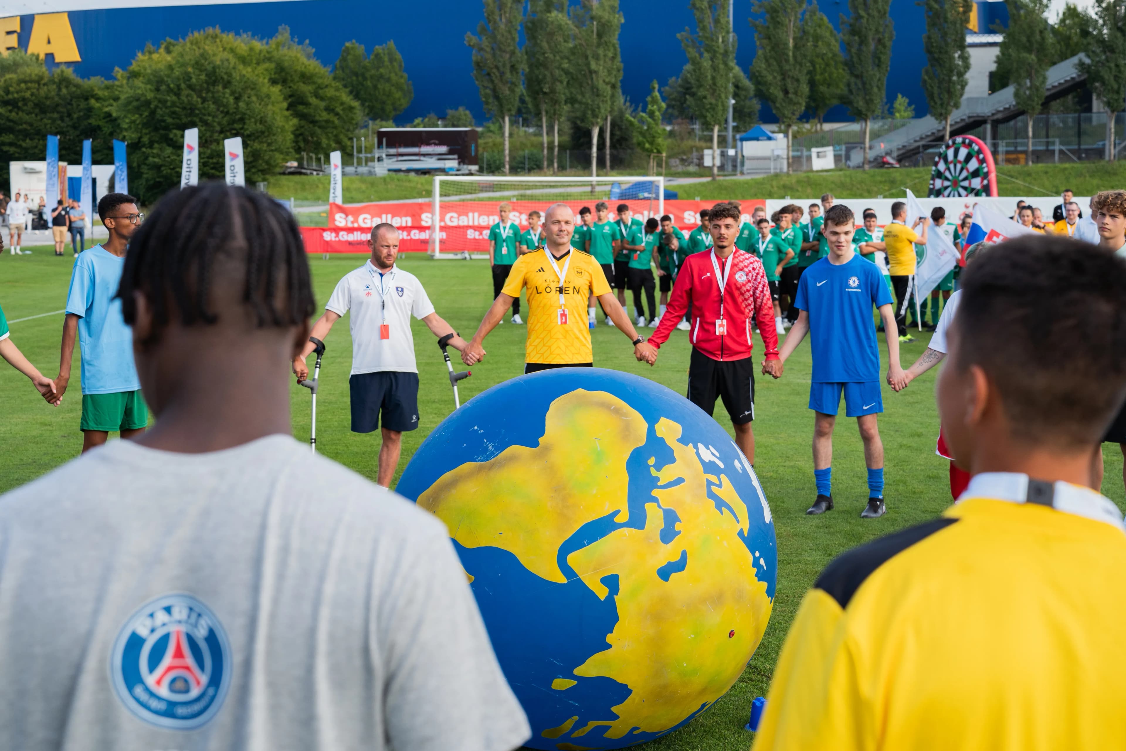 Volunteers supporting FOOTBALL IS MORE