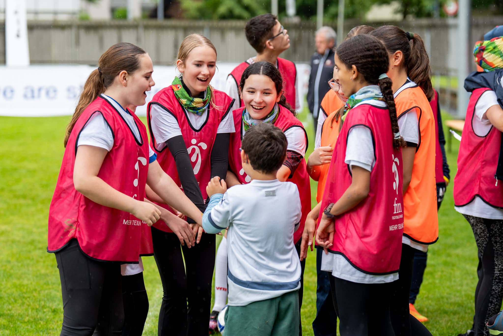 Children with and without disabilities sharing inclusive football training.