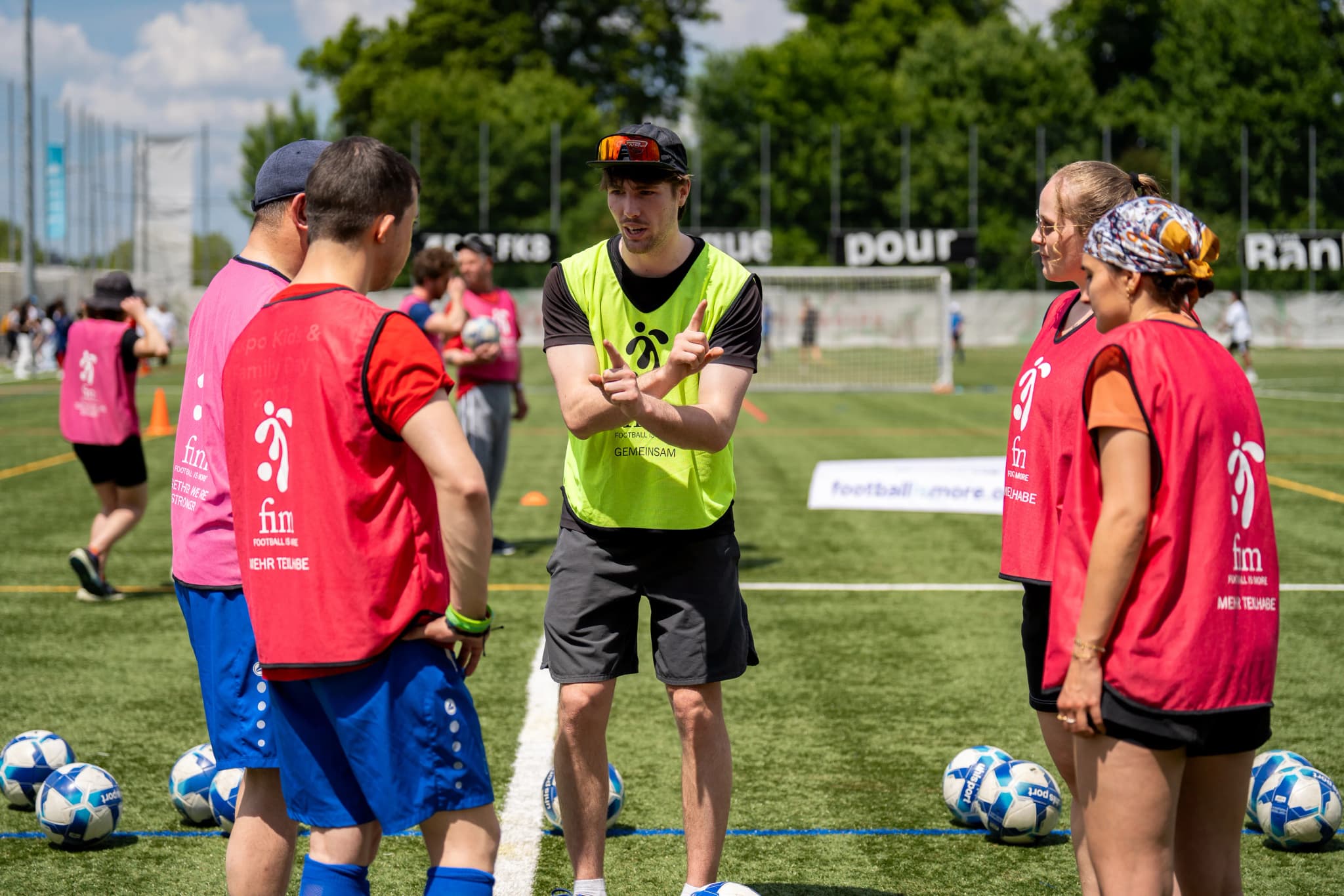 Coaches leading inclusive sports and education activities